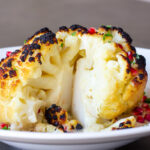 Whole Roasted Cauliflower with Pomegranate Tahini Sauce