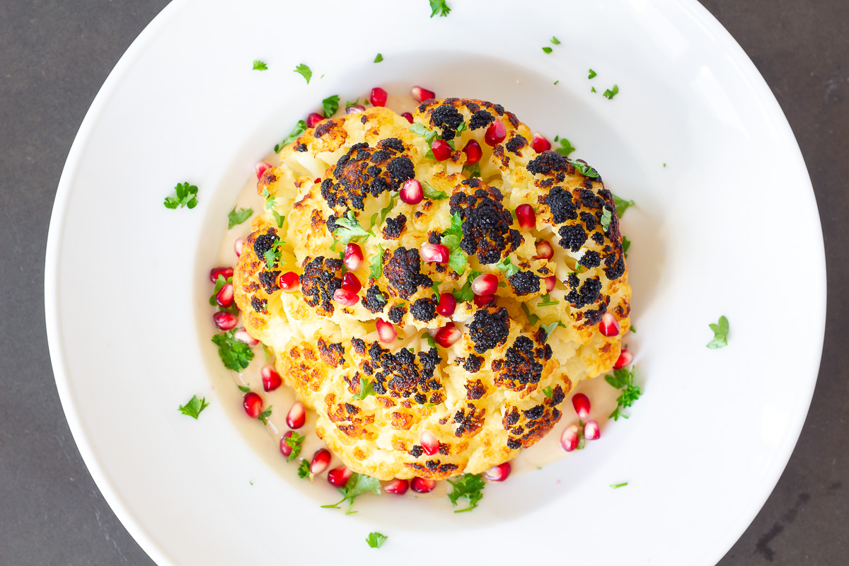 Whole Roasted Cauliflower with Pomegranate Tahini Sauce