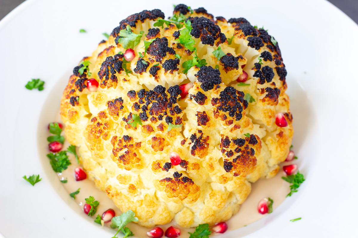 Whole Roasted Cauliflower with Pomegranate Tahini Sauce