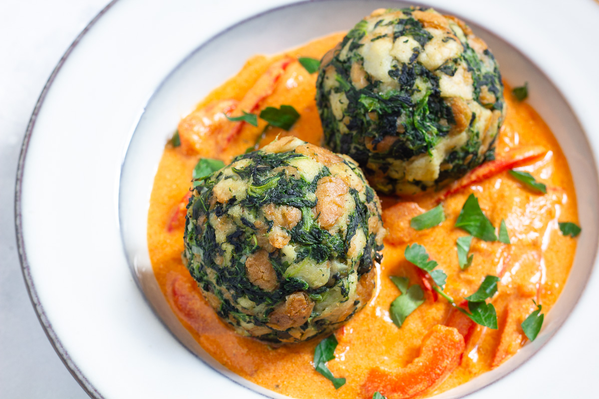 Vegan Spinach Dumplings with Red Pepper Cream Sauce